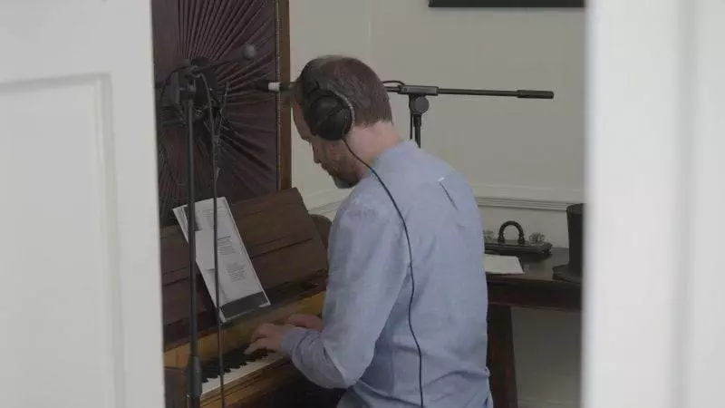 Adrian at work on Emily's rare five-octave cabinet piano. Courtesy of The Unthanks.