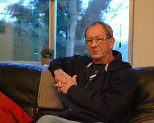 Author Chris Nickson relaxing on a couch at home